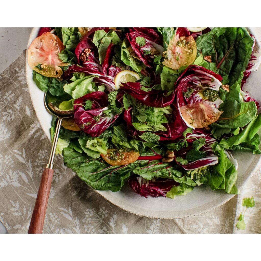 LARGE CHICORY SALAD WITH SPOON IN PLATTER