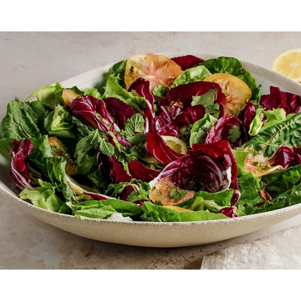 big salad on white ceramic stoneware