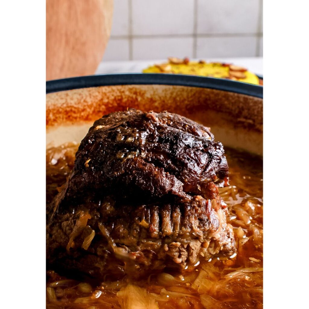 whole beef blade in a clay pot with onions